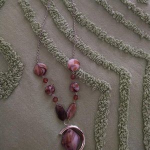 Long purple stone necklace.
